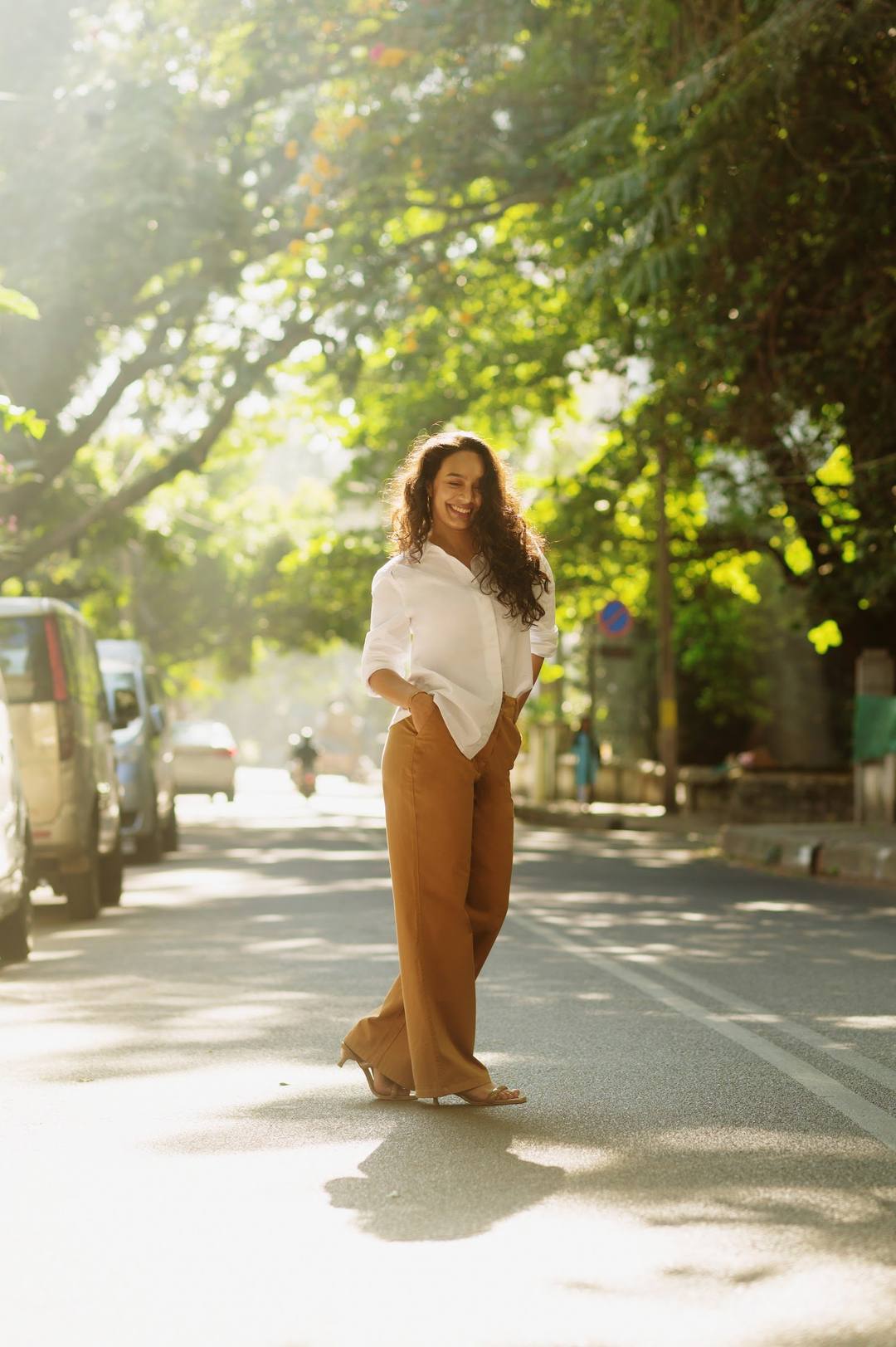 A woman in a white shirt out in the sun